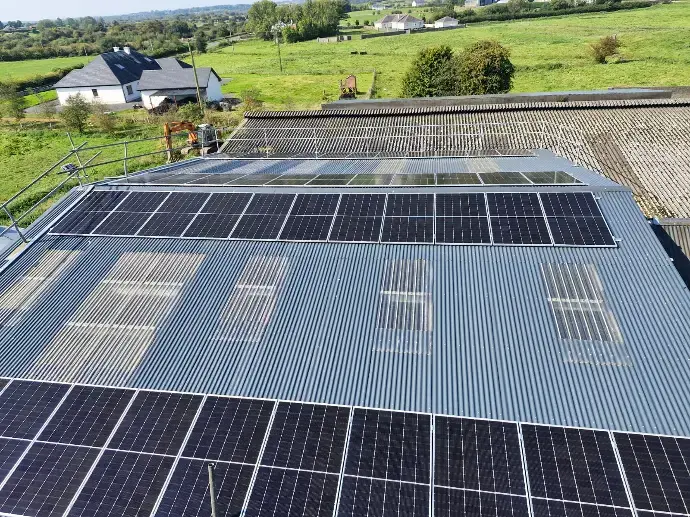 44 rooftop agricultural solar panels in Ireland on a farm.